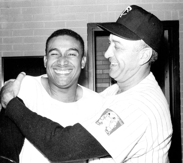 July 4, 1961: Manager Sam Mele hugs Julio Becquer