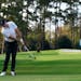 Rory McIlroy chips to the second green during the first round of the Masters