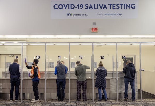 People at the new saliva COVID-19 testing site at the Minneapolis-St. Paul International Airport, Thursday, November 12, 2020.