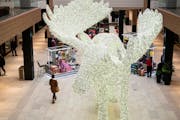 Shoppers walked past a large Moose made out of Christmas lights during the holiday season in 2019 at Rosedale Center.