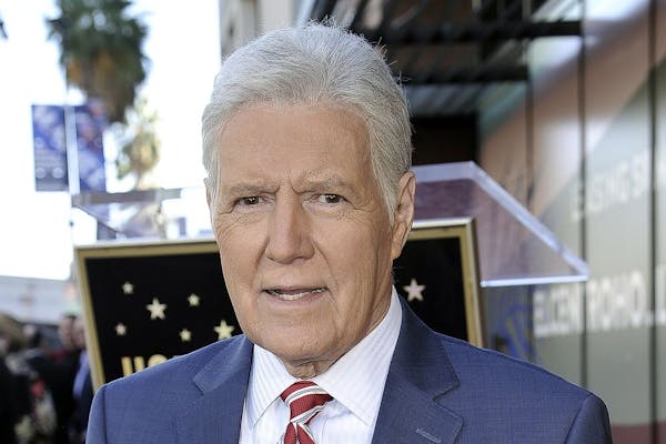 FILE - Alex Trebek, host of "Jeopardy!" attends a ceremony honoring the show's executive producer Harry Friedman with a star on the Hollywood Walk of 