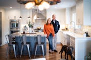 Kellie and Phil Schechinger, pictured with their dog, Marley, updated their Edina home to create an open floor plan.