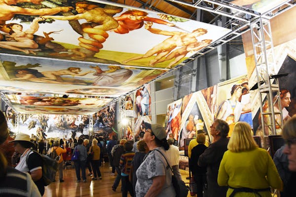 Visitors viewed "Michelangelo’s Sistine Chapel: The Exhibition" during a 2016 tour stop in Dallas. (Photo by John H. Parker/SEE Attractions/Bridgema