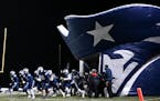 Champlin Park players ran out of their inflatable Rebels tunnel before Tuesday night’s game. ] AARON LAVINSKY • aaron.lavinsky@startribune.com Cha