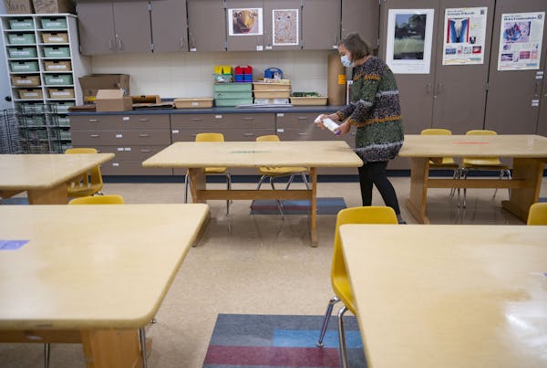 Sophie Gray Spehar disinfected each table in her art classroom at Duluth’s Piedmont Elementary School in September.