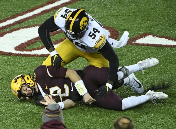 Iowa defensive tackle Daviyon Nixon sacked Gophers quarterback Tanner Morgan as the Hawkeyes poured it on in the second half at TCF Bank Stadium.