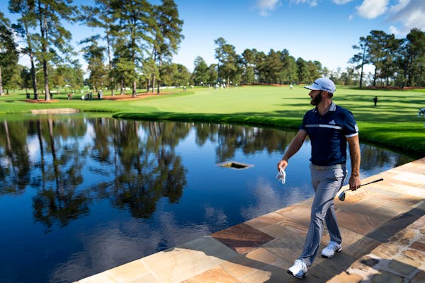 Dustin Johnson walks to the 15th green during round two at the Masters