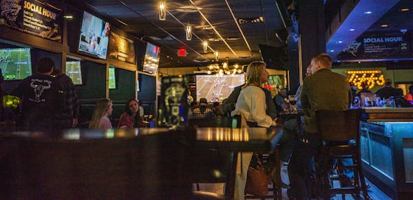 Tiffany Lounge on Ford Parkway had its share of patrons because bars shut down under Governor Walz’s orders.] With bars closing down Friday at midni