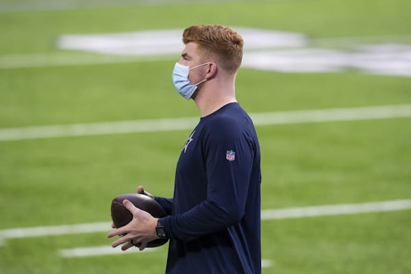 Dallas Cowboys quarterback Andy Dalton (14) looks on before the start of an NFL football game against the Minnesota Vikings, Sunday, Nov. 22, 2020, in