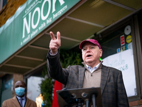 Gov. Tim Walz stood in front of Casper’s and Runyon’s Nook in St. Paul to roll out a proposal for a legislative relief package aimed at helping bu