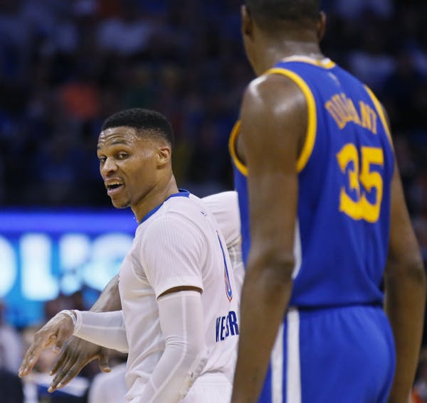 Thunder guard Russell Westbrook, left, and Warriors forward Kevin Durant — teammates once, now with different support.