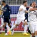 Minnesota United midfielder Osvaldo Alonso (6) celebrates after a goal by Bakaye Dibassy during the first half of the team's MLS soccer match against 