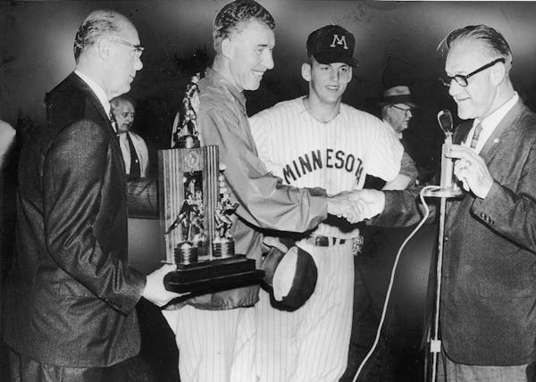 Gophers baseball coach Dick Seubert and second baseman John Erickson in 1960.
