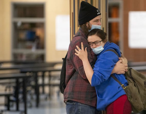 Gavin Lawrence embraced his girlfriend, Chace Johnson, in between classes at South Ridge School. It is one of only a few school buildings in Minnesota