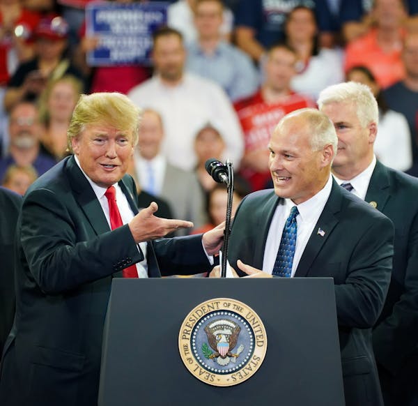 President Donald Trump and U.S. Rep. Pete Stauber at a 2018 campaign rally in Duluth. Rep. Tom Emmer is behind Stauber.