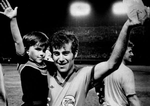 Aug. 11, 1976: Alan Merrick, captain of the Minnesota Kicks, hoisted his son, Adam, 4 years old, for a victory wave after the Kicks stomped the Los An