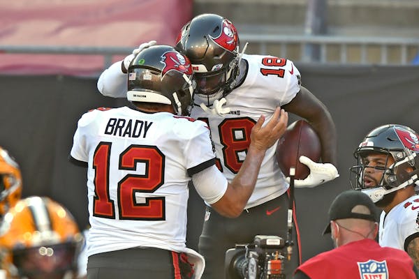 Tampa Bay Buccaneers wide receiver Tyler Johnson celebrates with quarterback Tom Brady (after Johnson caught a 2-yard touchdown pass against the Green