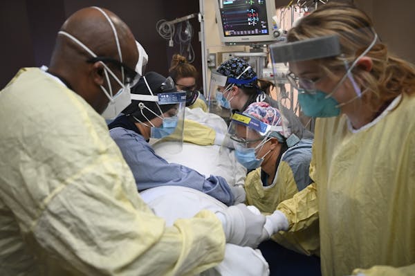 Critical care nurses and respiratory therapists flipped a COVID-19 patient upright in North Memorial’s South Six Intensive Care Unit in Robbinsdale 