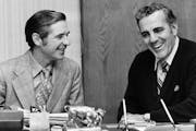 Dan Devine, left, and Ara Parseghian went over transitional matters in Parseghian’s office at Notre Dame on Dec. 17, 1974. Devine left the Packers t