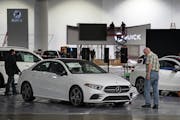 Crews prepared for the 2020 Twin Cities Auto Show in March at the Minneapolis Convention Center. (BRIAN PETERSON/Star Tribune)