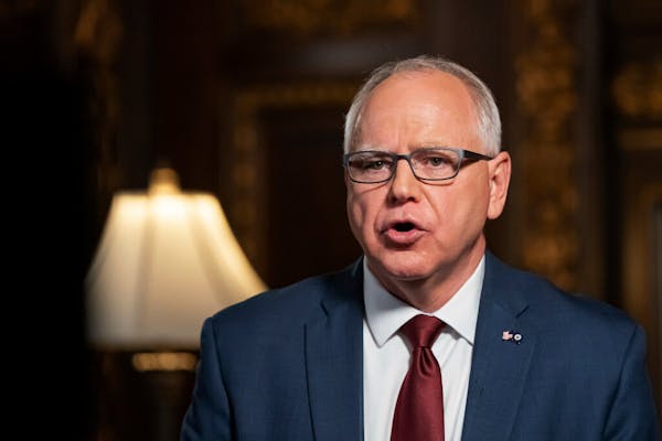 Gov. Tim Walz spoke about his COVID-19 response on Nov. 18, 2020, in St. Paul. Walz’s executive order closing bars and restaurants is set to expi