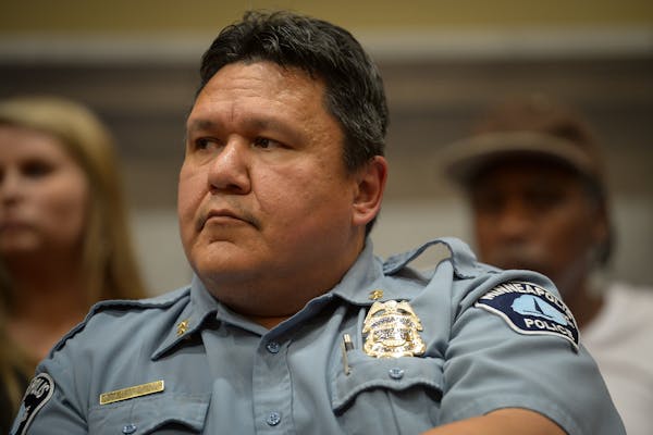 Minneapolis Police Deputy Chief Henry Halvorson listened in to public comments during Thursday&#39;s public safety meeting at city hall.       ] AARON