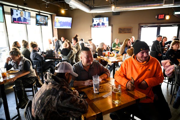 Patrons packed every table at Alibi Drinkery in Lakeville, Minn., Wednesday, Dec. 16, 2020. An attorney representing Alibi Drinkery co-owner Lisa Mone