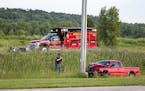 A Wisconsin State Patrol officer took photos of a crash scene involving a pick-up truck and a motorcycle on July 3, 2020, northeast of Fond du Lac.