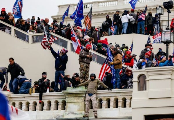 SAMUEL CORUM, TNS - TNS Pro-Trump supporters storm the U.S. Capitol following a rally with President Donald Trump on Wednesday, Jan. 6, 2021 in Washin