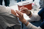 Minnesota’s COVID-19 vaccination progress, including the second-highest rate of booster shots among states, has been credited with helping to ease t