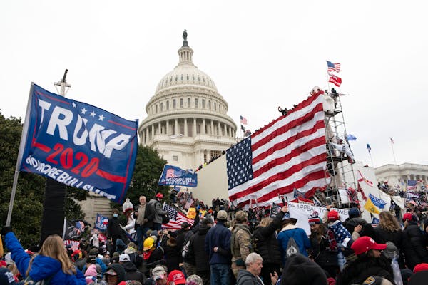 In this Jan. 6 photo, supporters of President Donald Trump stood outside the U.S. Capitol in Washington. 