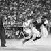 Mike Sadek chases down a wild throw during a 1979 game between the Giants and Reds after Pete Rose crossed home plate.
