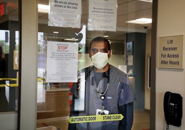 Emergency Room physician Dr. Mohammed I. Hussain seen in May just inside the entrance to CentraCare Health in Monticello. The spring stressed hospital
