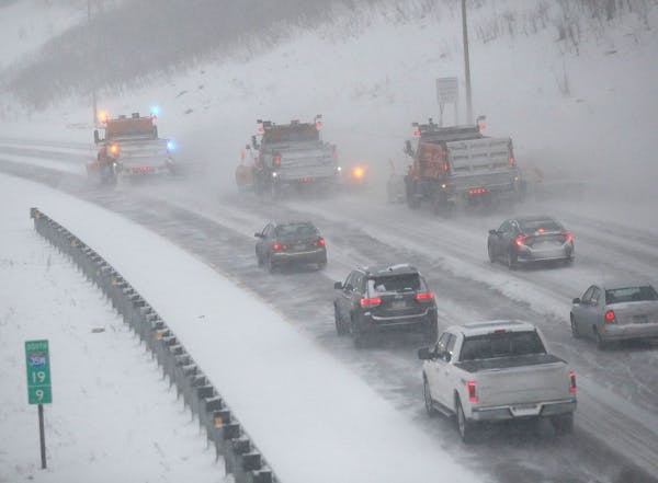 Traffic creeps behind snow plows heading south on I-35W in Minneapolis during an early 2020 snowstorm.Star Tribune photo/David Joles