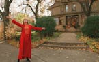 This photo taken in 1996 shows Mary Tyler Moore tossing her hat up as she revisits the Minneapolis Kenwood neighborhood house which was her television