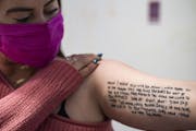 Brittani Senser has a poem tattooed on her arm from daughter Aria Burch-Senser, a 13-year-old African American student at Lake Harriet Upper School wh