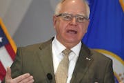 Gov. Tim Walz answers a question during a news conference to debut his state budget plan for the next two years on Jan. 26 at the Department of Revenu