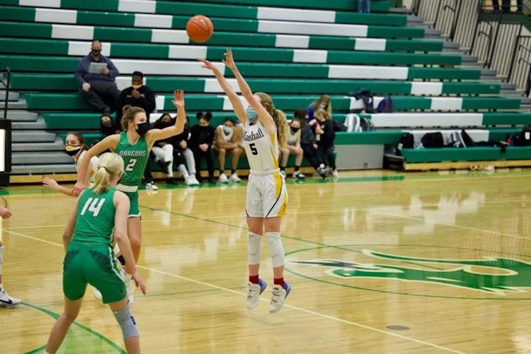 Gianna Kneepkens of Duluth Marshall made this shot to record the 3,000th point of her high school career at Pine City.