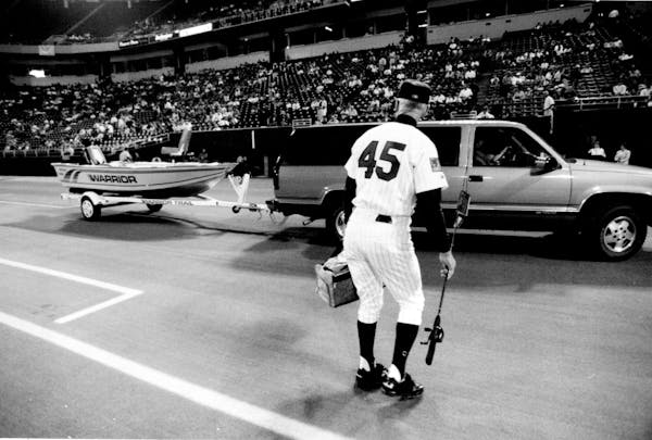 Twins players presented Wayne Terwilliger with a fishing boat at the Metrodome when he retired in 1994. Terwilliger died on Wednesday at 95.