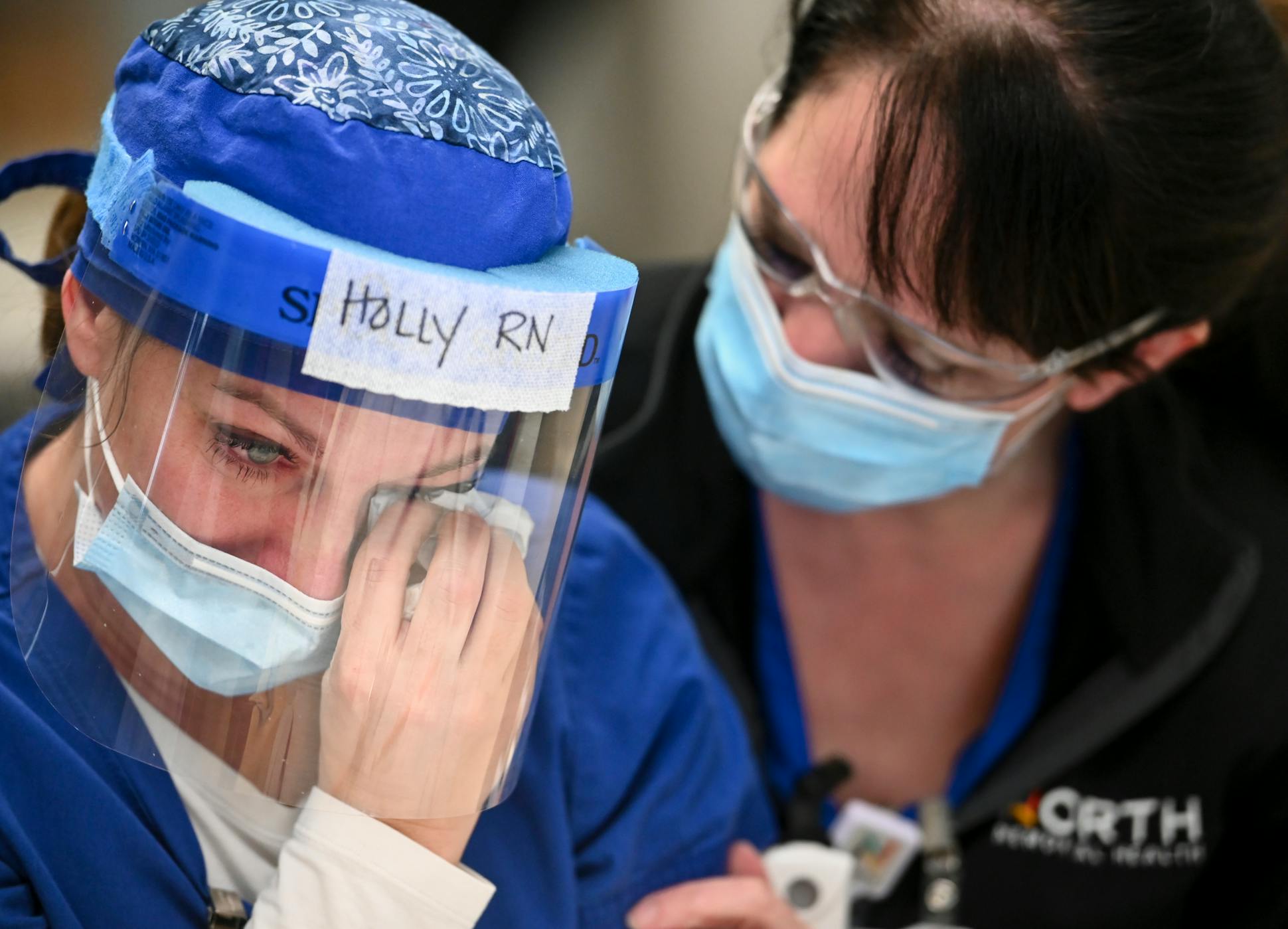 After losing her mother-in-law to COVID, “I'm struggling. They know it,” Holly Vilione said as she was comforted by friend and fellow ICU nurse Amy Berwald.