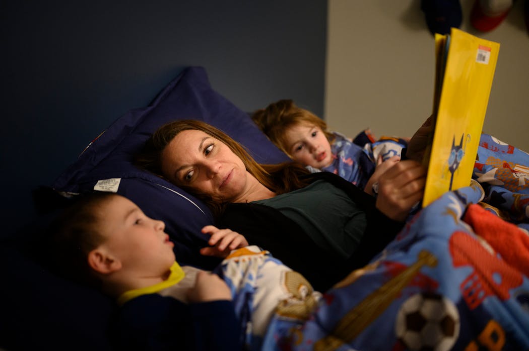 Holly Vilion read a bedtime story to her son, Reed, 6, and daughter Nora, 2, in mid January.