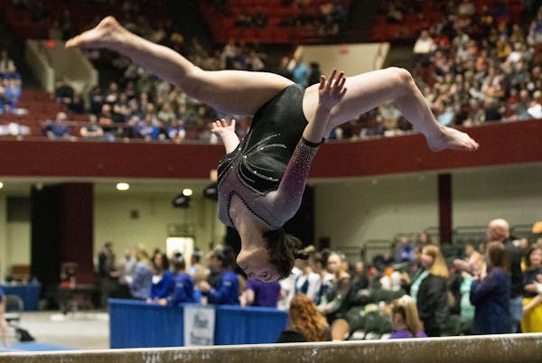 Livia Dombeck of St. Michael-Albertville competed on the balance beam at Roy Wilkins Auditorium in St. Paul on Saturday, February 22, 2020. ] Special
