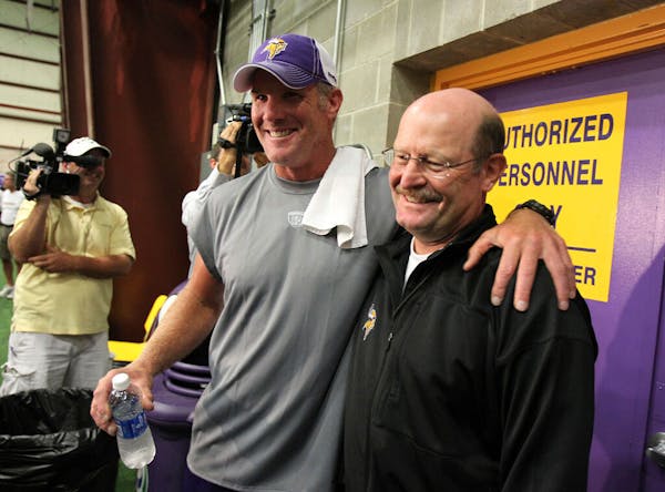 Brett Favre and Vikings coach Brad Childress were all smiles after Favre’s first day of practice in 2010.
