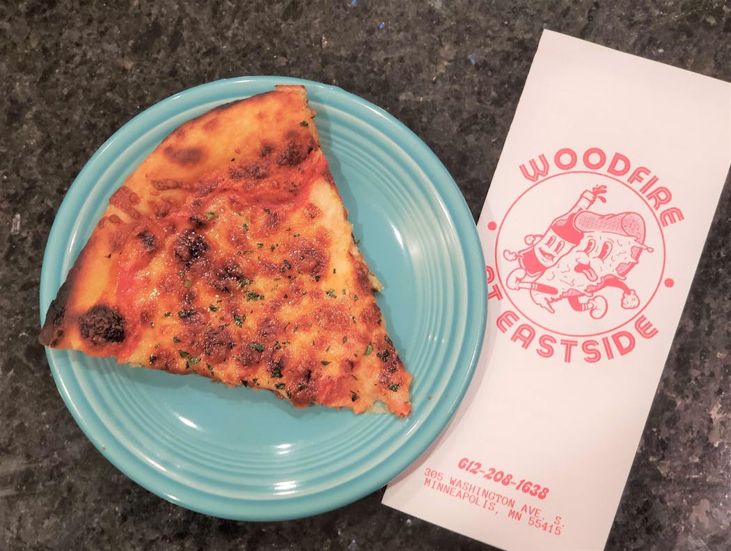 Cheese pizza with garlic and parsley from Woodfire at Eastside