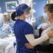 Nurse Holly Vilione comforted Deb Ulrich as she visited her COVID-stricken husband in the ICU. For weeks, Vilione gave Ulrich phone updates from North