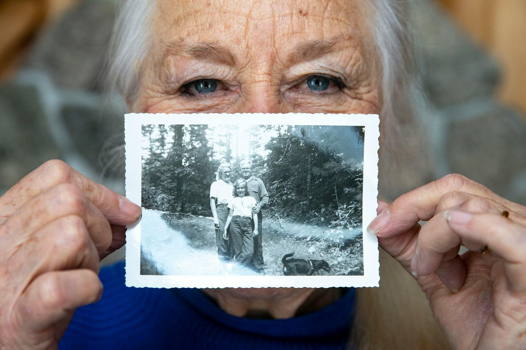Joyce Leddy showed a picture of herself, top, as a young girl with her parents during a visit to the Gunflint region.