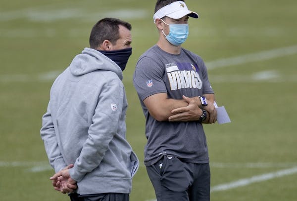 Klint Kubiak (right) watched a practice with his father Gary last year.