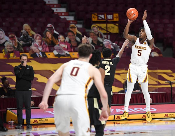 Gophers guard Marcus Carr hit a 3-pointer to give the Gophers a one-point lead with 11.2 seconds left vs. Purdue
