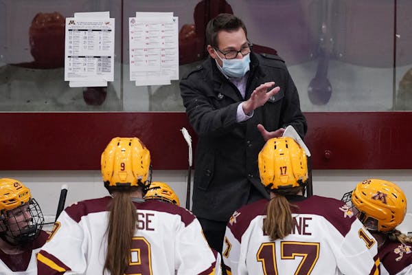 Minnesota head coach Brad Frost talked with players during a timeout earlier this season.