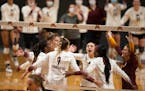 The Gopher volleyball team celebrated remaining undefeated after the final point in the last set.